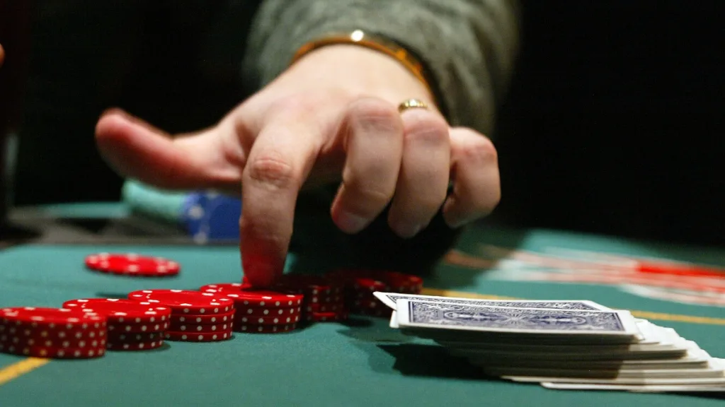 A poker player observing opponents during an online game